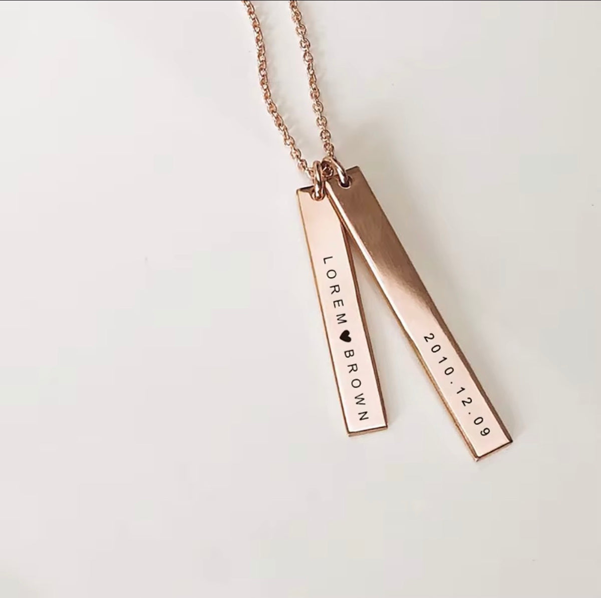 Personalized engraved bar necklace with two vertical pendants in rose gold finish