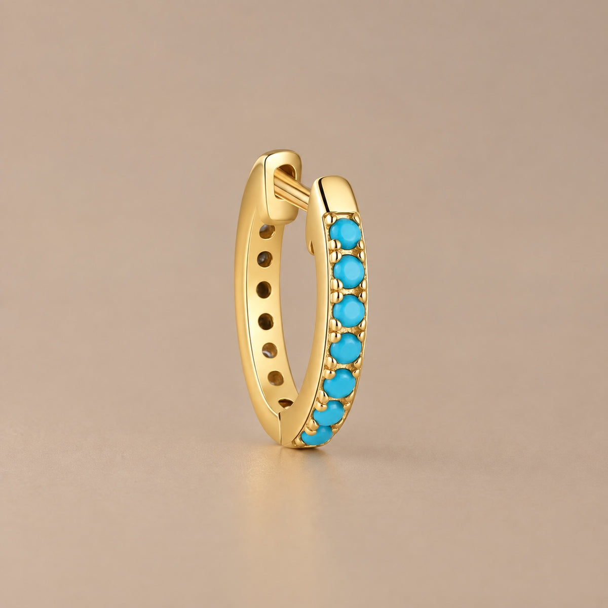 Turquoise huggie hoop studio view