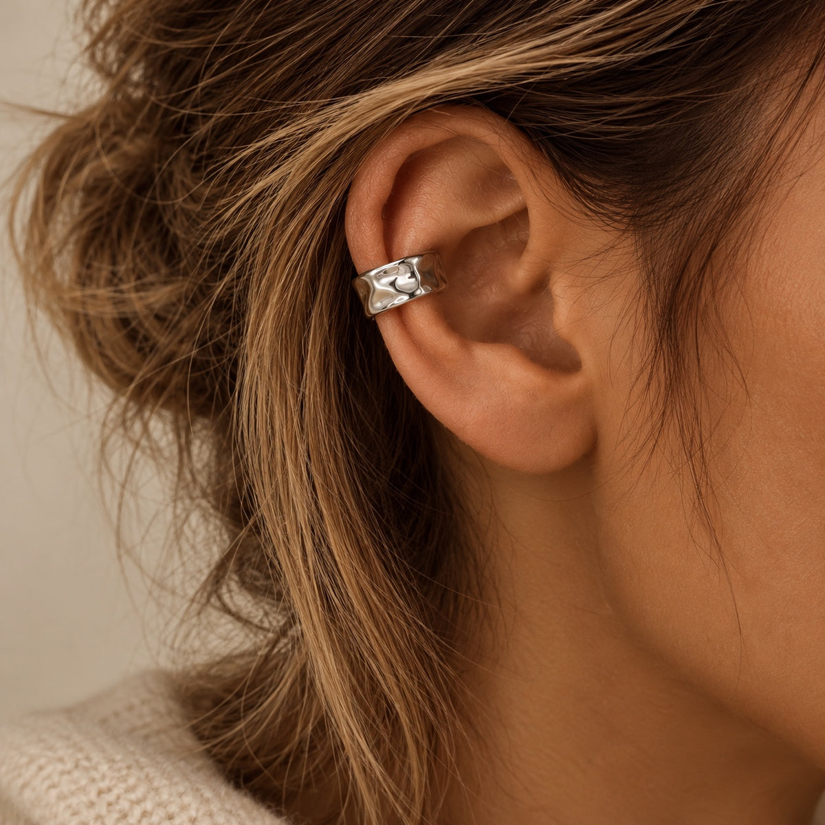 Mara Ear Cuff in silver worn on ear