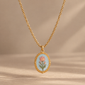 The Fleurie Hand-Painted Medallion Necklace – Blue Tulip, suspended product photo