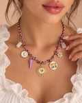 Good Luck charm necklace worn with blush manicure
