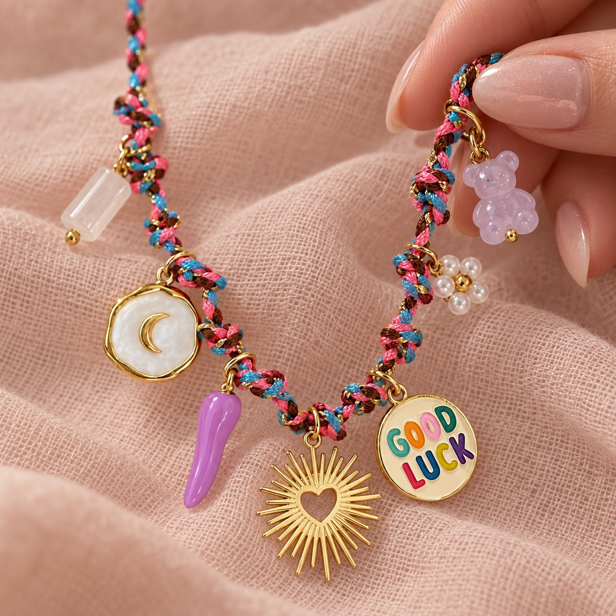 Good Luck charm necklace teddy and charm macro detail