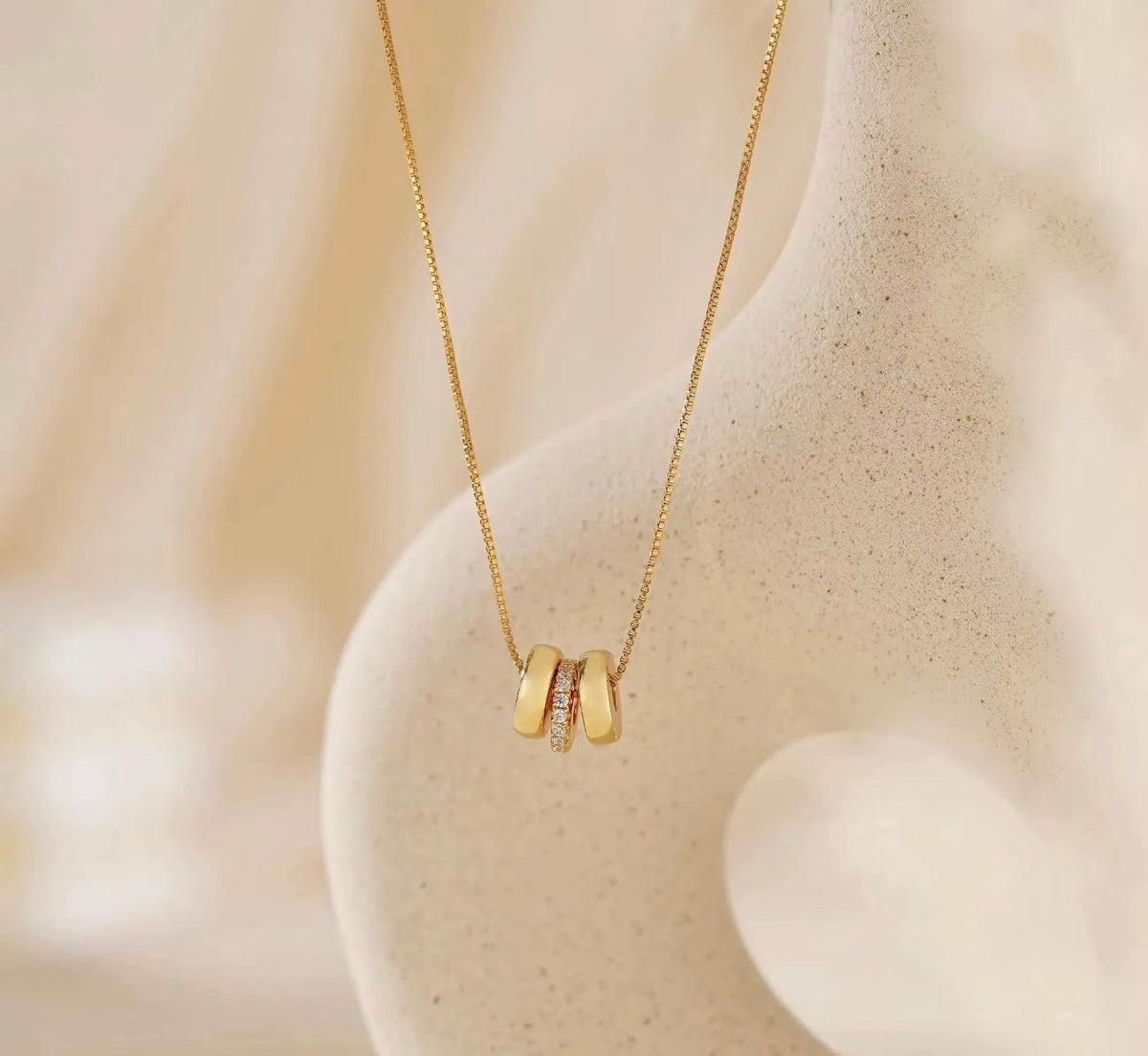 The Lyra gold personalized name bead necklace with crystal spacer