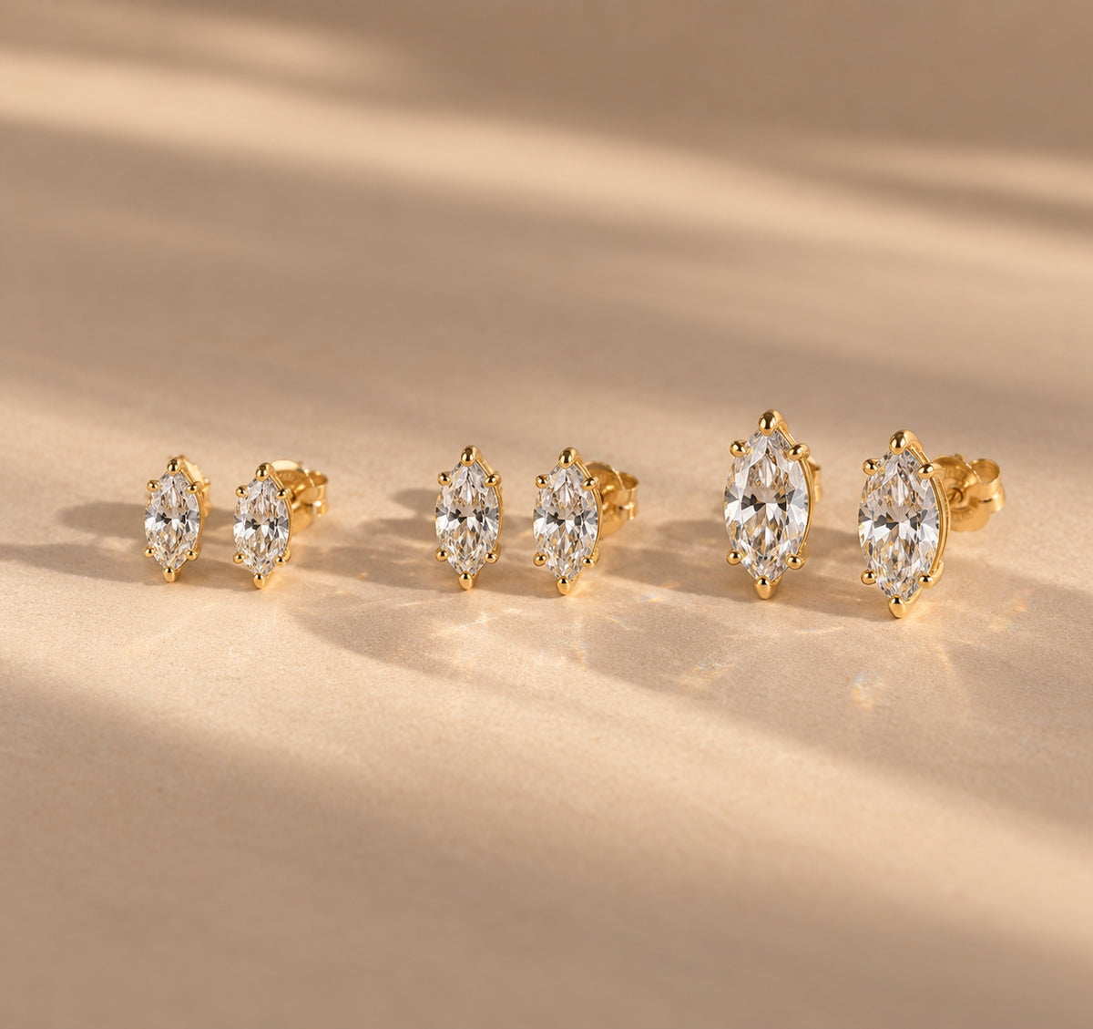 Marquise stud earrings in three sizes – gold