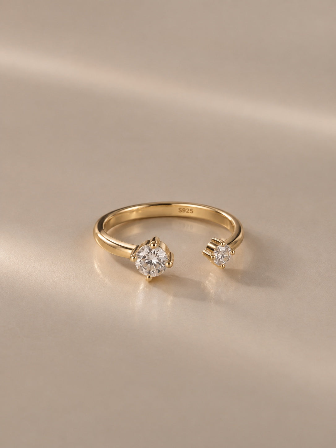 Lumi Two-Stone Ring in gold – studio front view