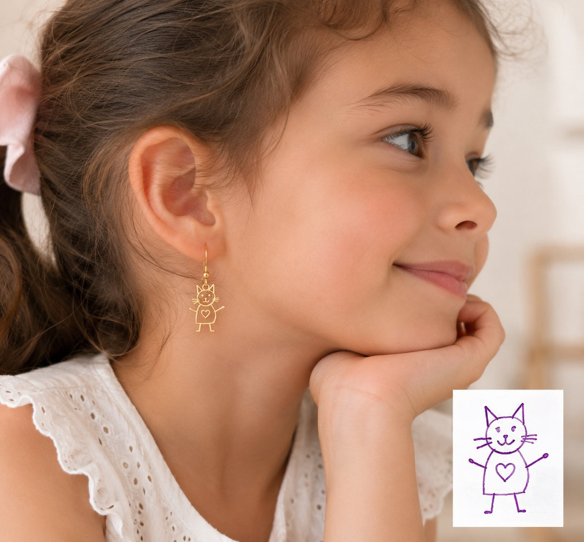 Personalized gold cat earrings made from a child's original drawing