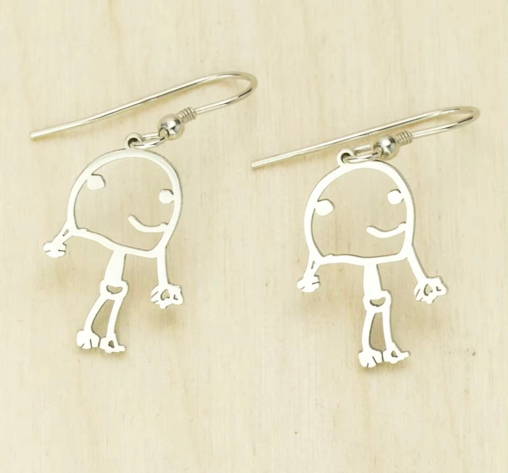Silver personalized earrings created from a child's drawing