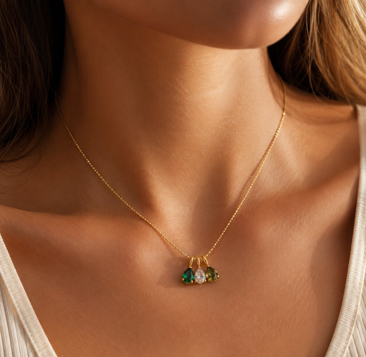 The Rosie birthstone necklace with three stones worn as a delicate everyday necklace