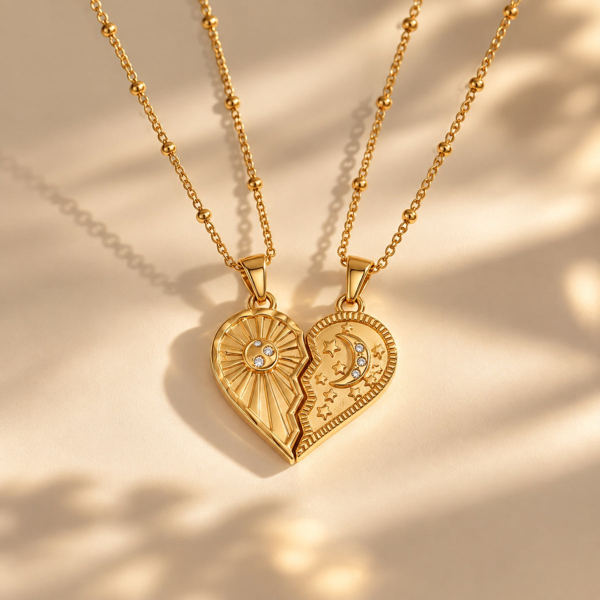 The Solstice Heart Duo necklace set - gold sun and moon heart pendants