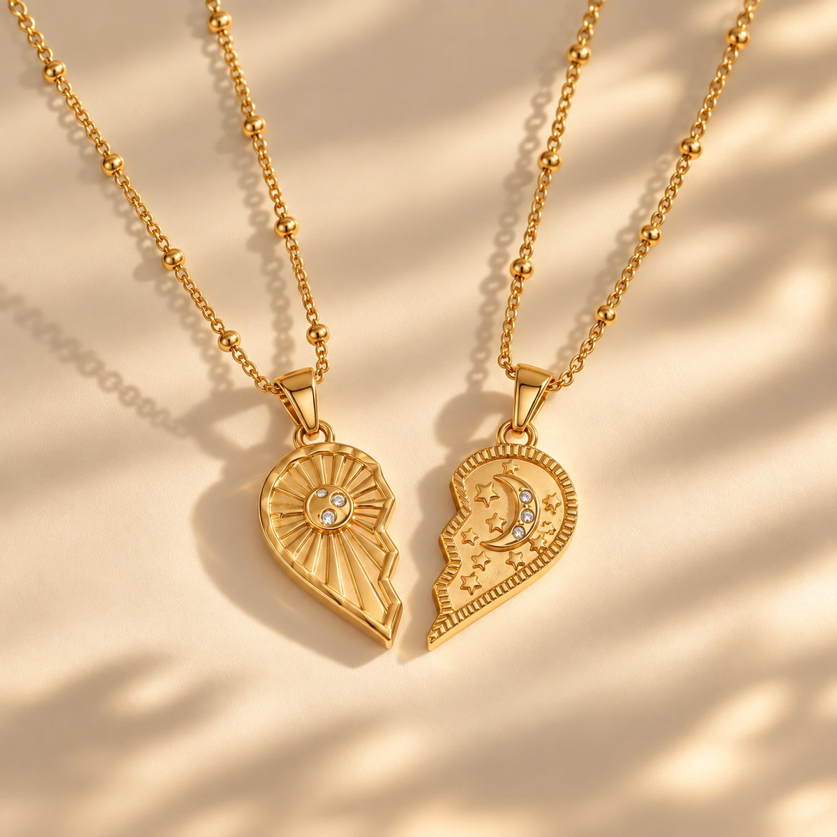 The Solstice Heart Duo necklace set - separated sun and moon halves