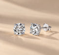 Claire round moissanite studs in silver