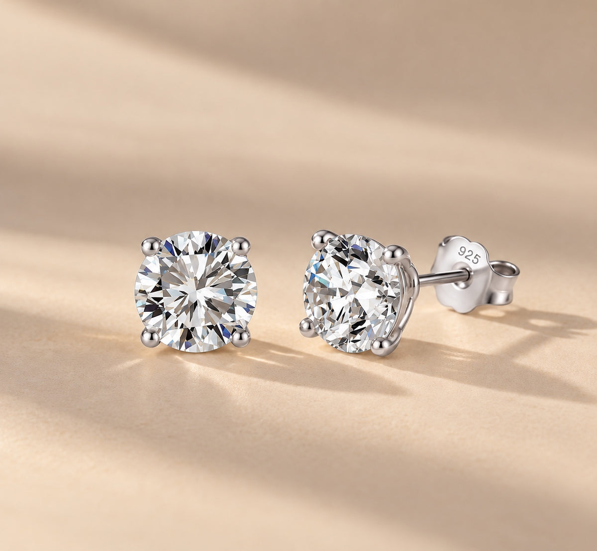 Claire round moissanite studs in silver