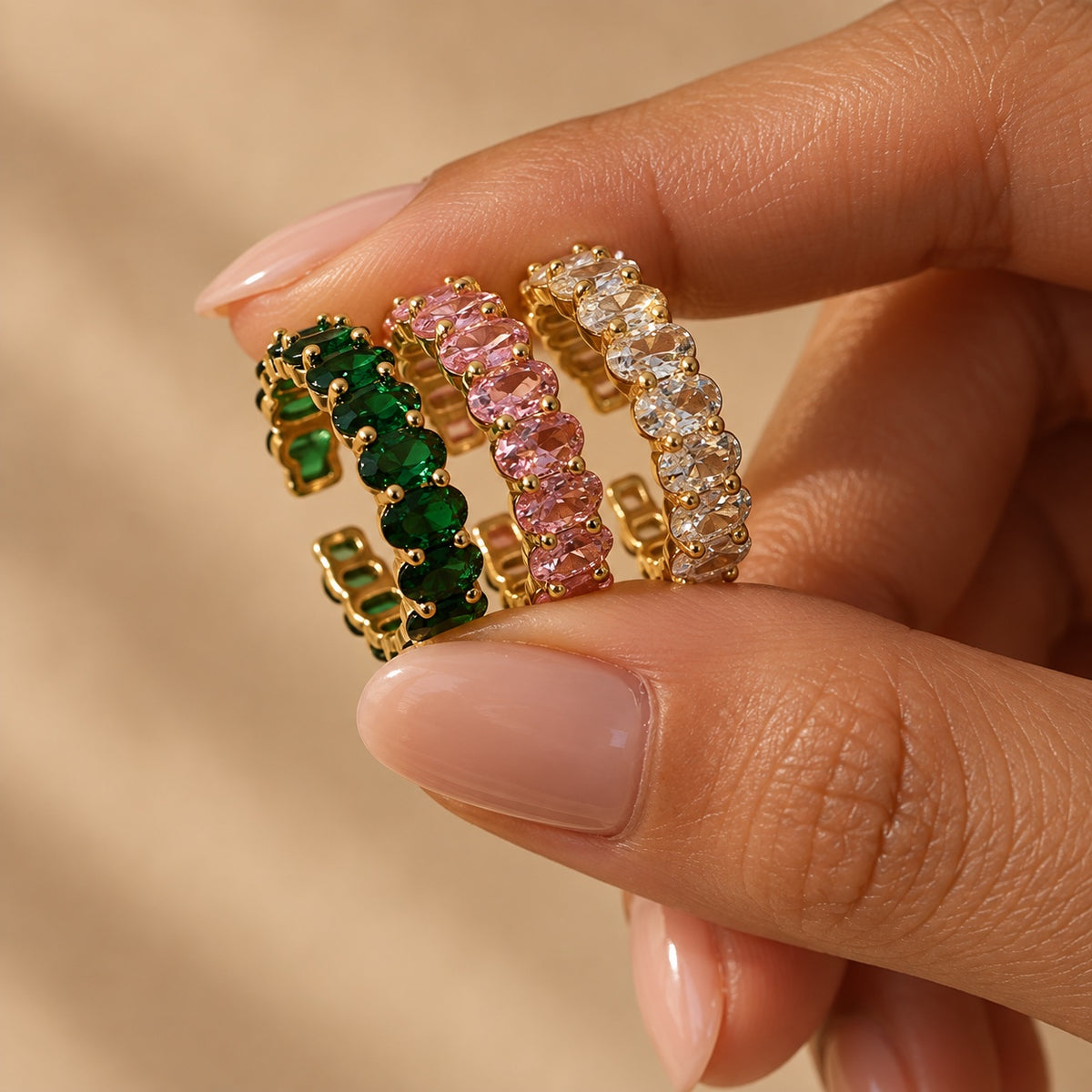Gemline green pink and clear zircon rings close up