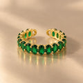 Gemline green oval zircon ring on beige background
