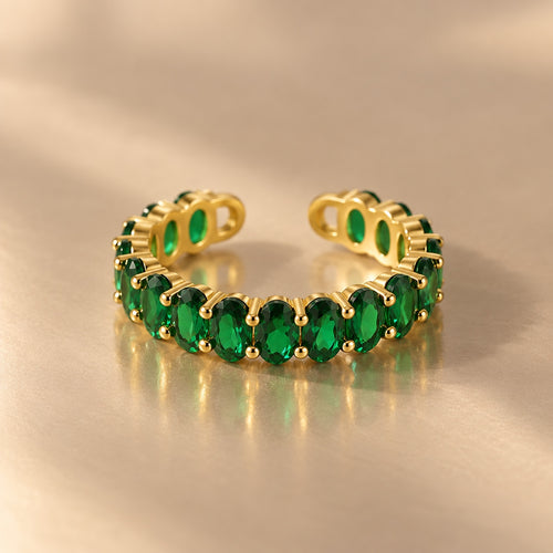 Gemline green oval zircon ring on beige background