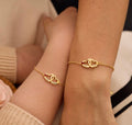 Personalized double heart birthstone bracelet in gold finish
