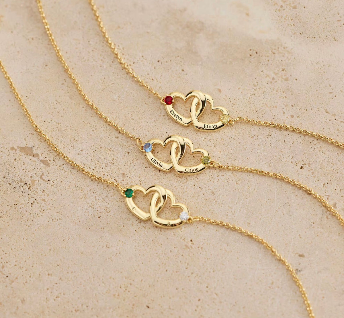 Close-up personalized interlocking heart birthstone bracelet