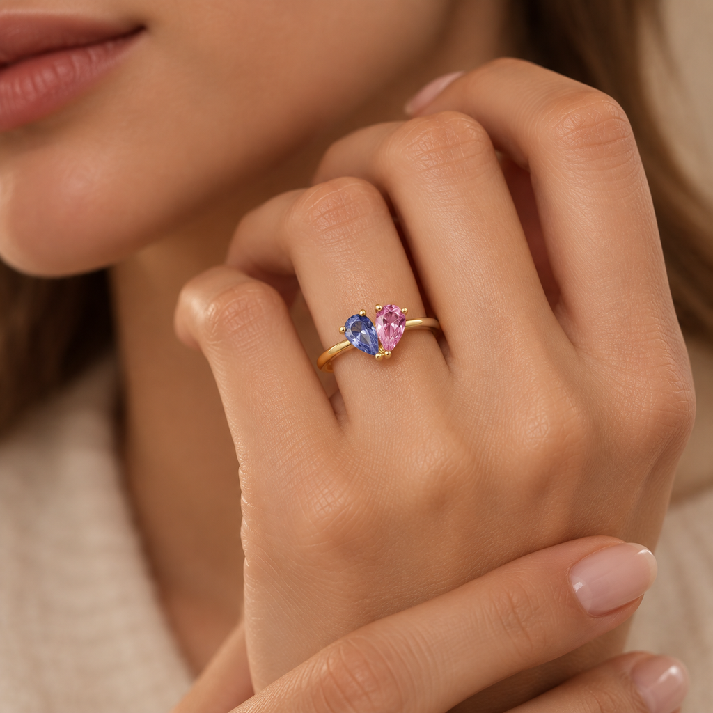 Toi et Moi gold ring with blue and pink pear-cut stones